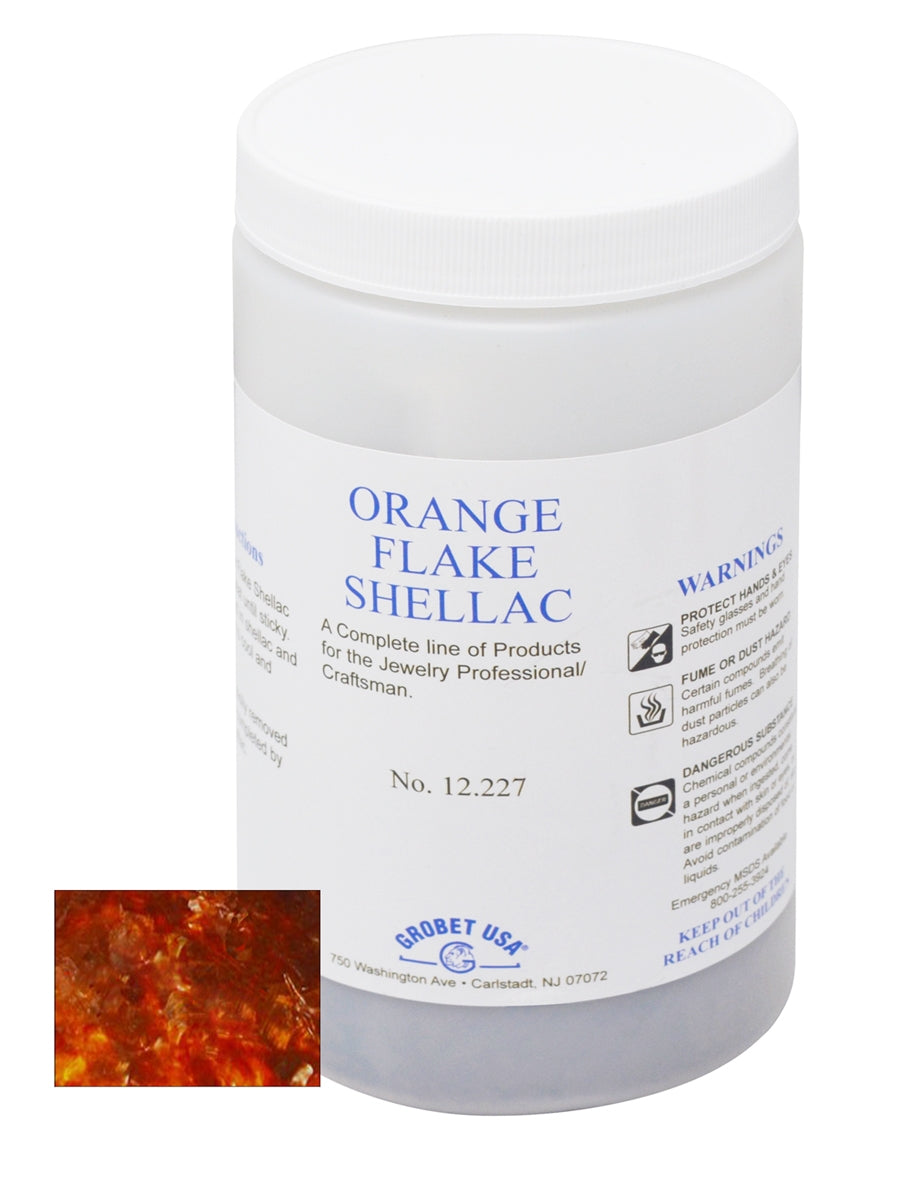 6 Oz Orange Flake Shellac container for heat-activated jewelry adhesive with orange flakes close-up