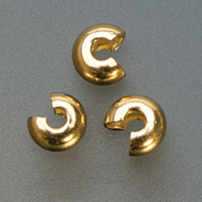 Three 3mm gold plated crimp covers for jewelry finishing and concealment.