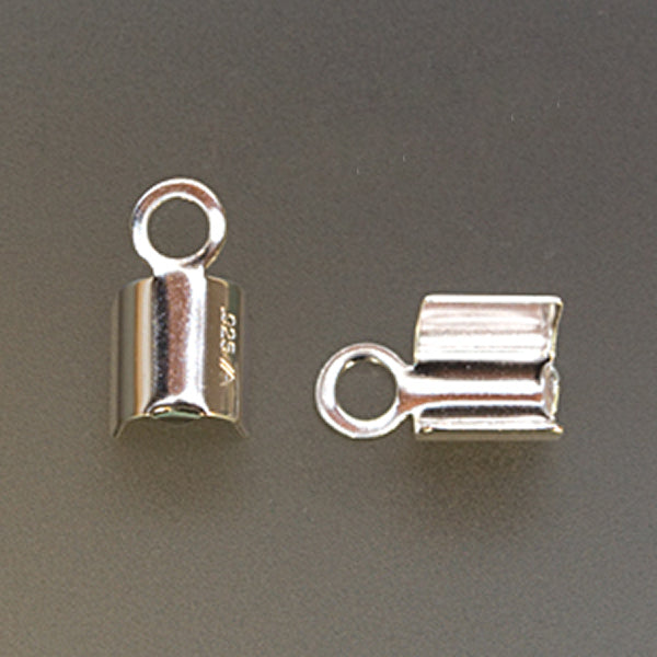 Close-up of two silver plated foldover open end cords for jewelry making