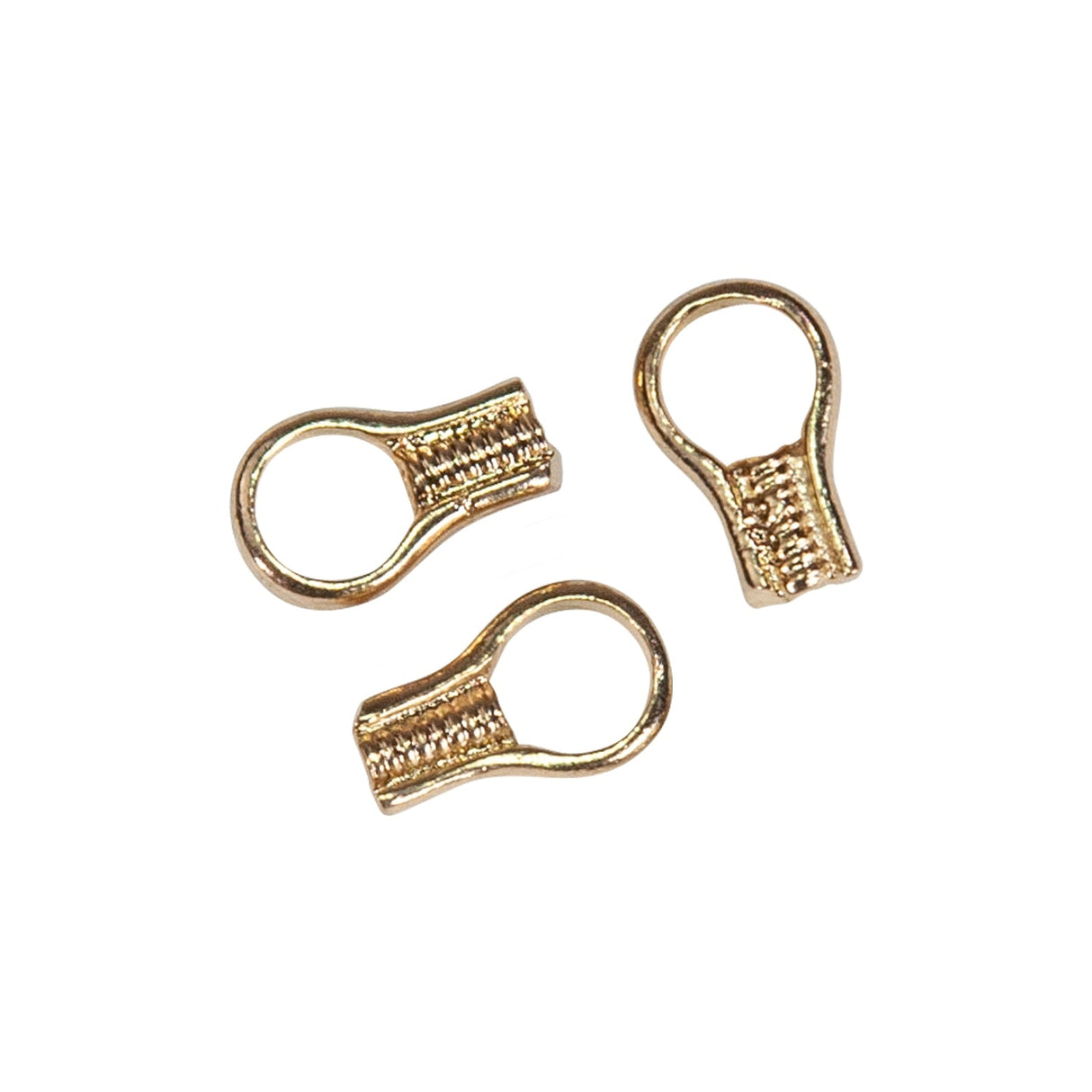 Three gold plated EZ crimp ends for jewelry making on white background