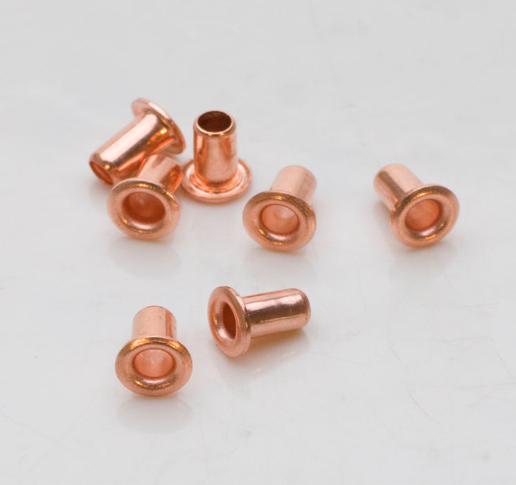 Set of copper-plated eyelets with 5/32 inch diameter and semi-rounded heads for crafting projects