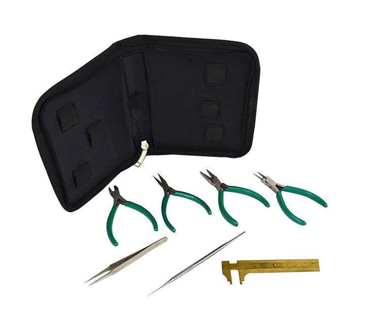 7-piece beading tool kit with green-handled pliers, brass gauge, needle, tweezers and black storage case
