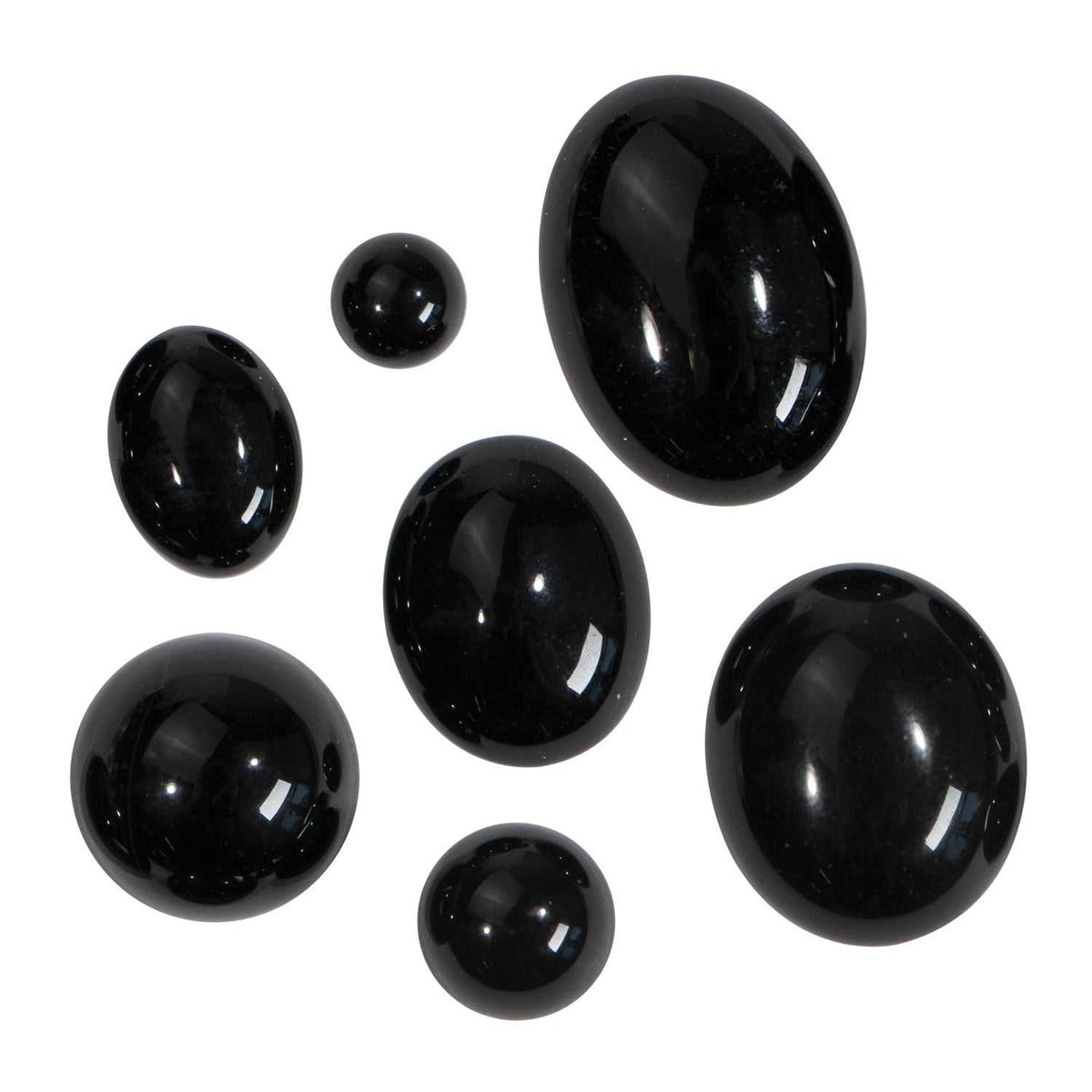 Black Onyx Oval Cabochon stones in various sizes, glossy polished black with smooth, domed surfaces for jewelry making.