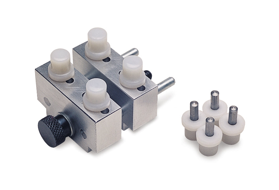 Compact metal case holder with adjustable clamps and replacement pins for precise secure gripping in workshops and hobby setups