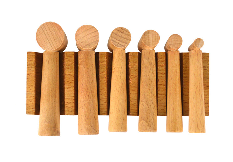 Hardwood U-Channel Swage Block with six hammer punches and various channel widths for woodworking and metalworking tasks