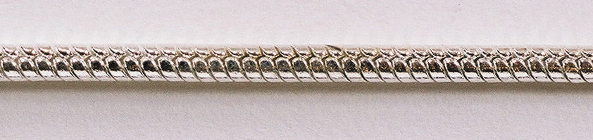 Close-up of 39-inch silver eye loupe chain snake design with durable silver-tone finish