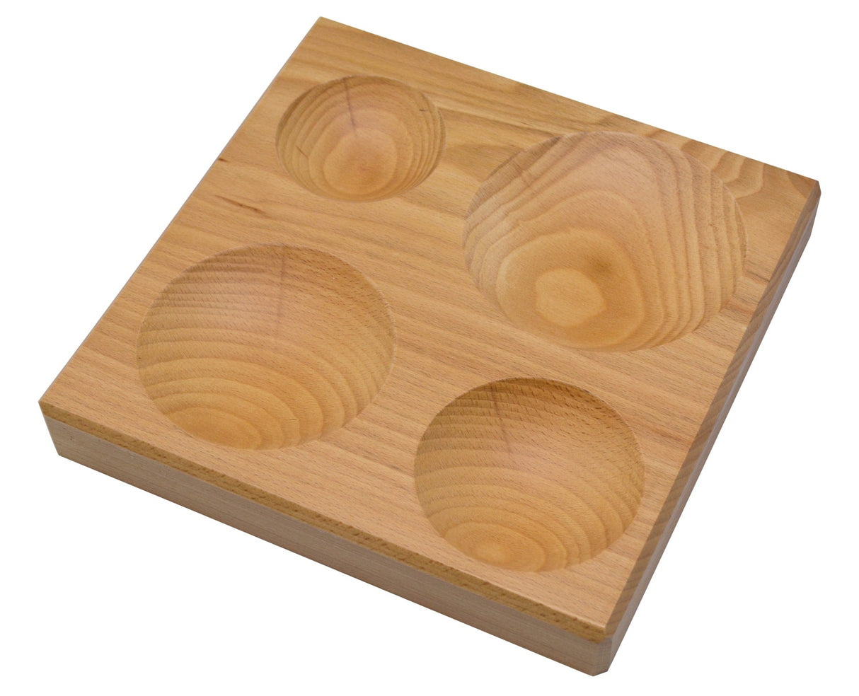 Large wooden dapping block with four round impressions for metal shaping and jewelry making