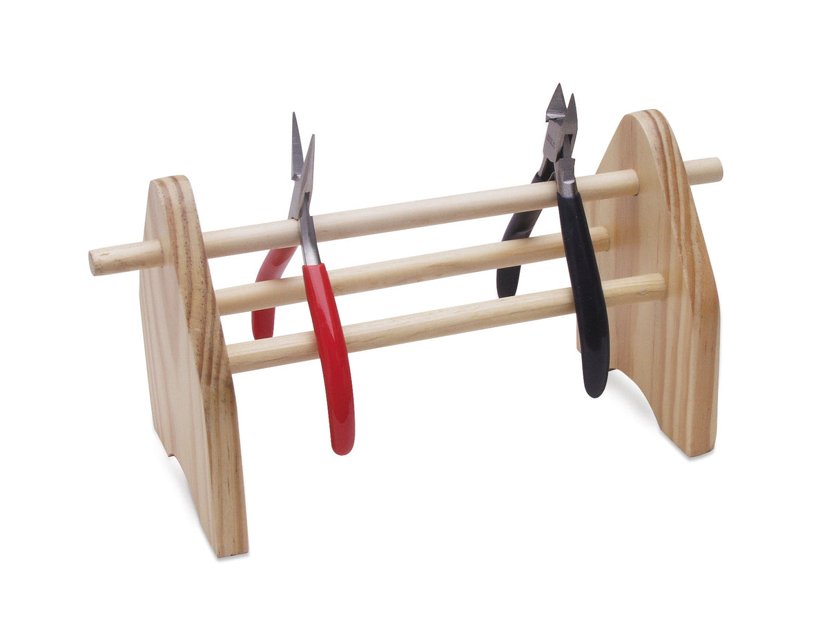 Wooden plier storage rack holding multiple pliers with simple design for workshop organization