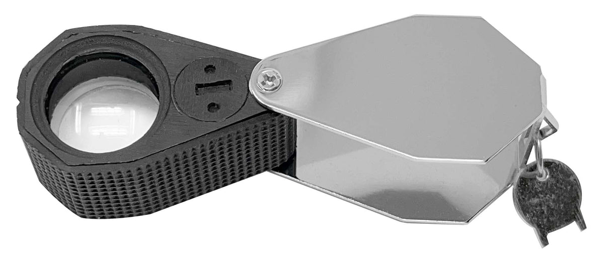 Eye Loupe 20X Triplet with a clear lens, black textured rubber grip, chrome folding casing and attached metal clip.
