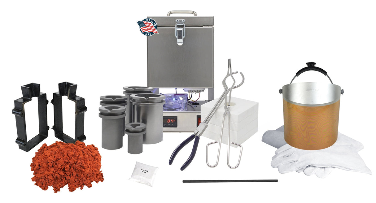 Deluxe TableTop QuikMelt Furnace with sand casting set, safety gear, Petrobond sand, crucibles, and mold frame on workbench