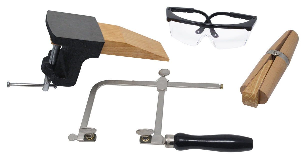 Jewelers set with bench pin, sawframe, safety glasses, and ring clamp for precision metalworking and jewelry making