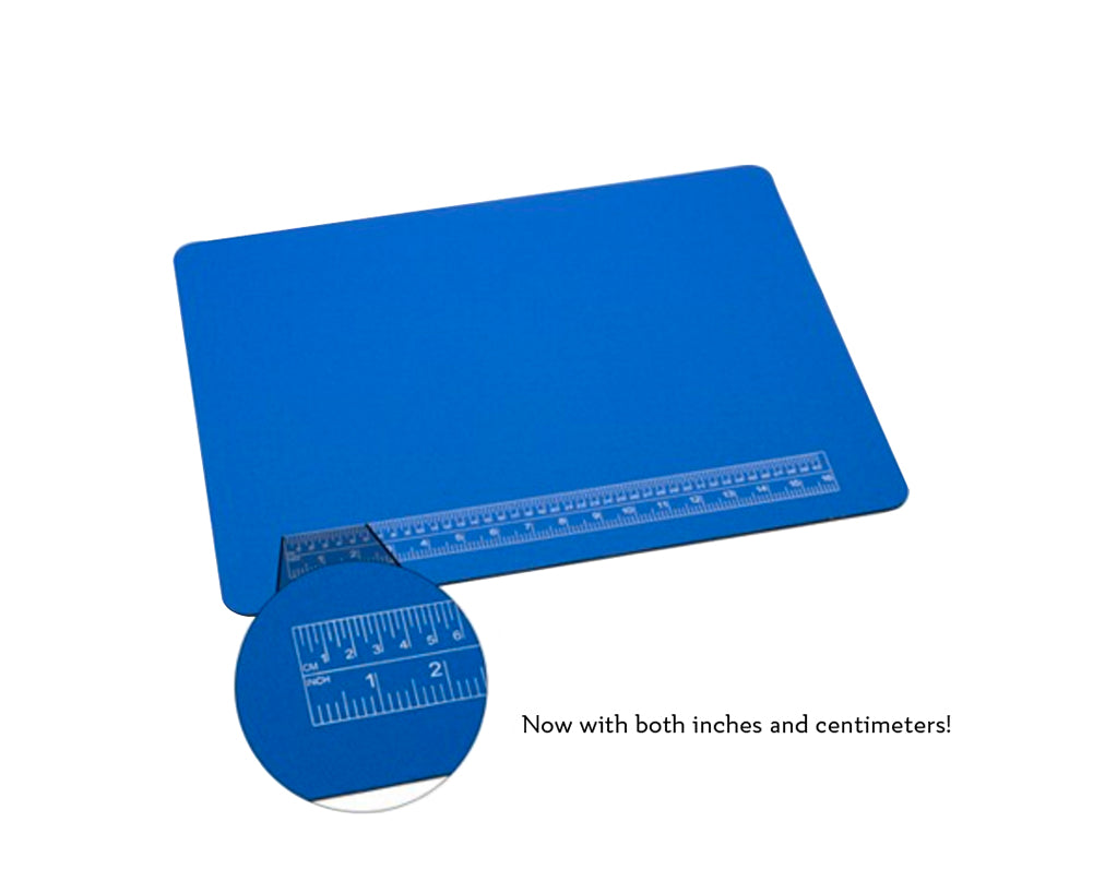 Blue 20x15 inch padded work mat with built-in ruler featuring inches and centimeters and non-slip backing