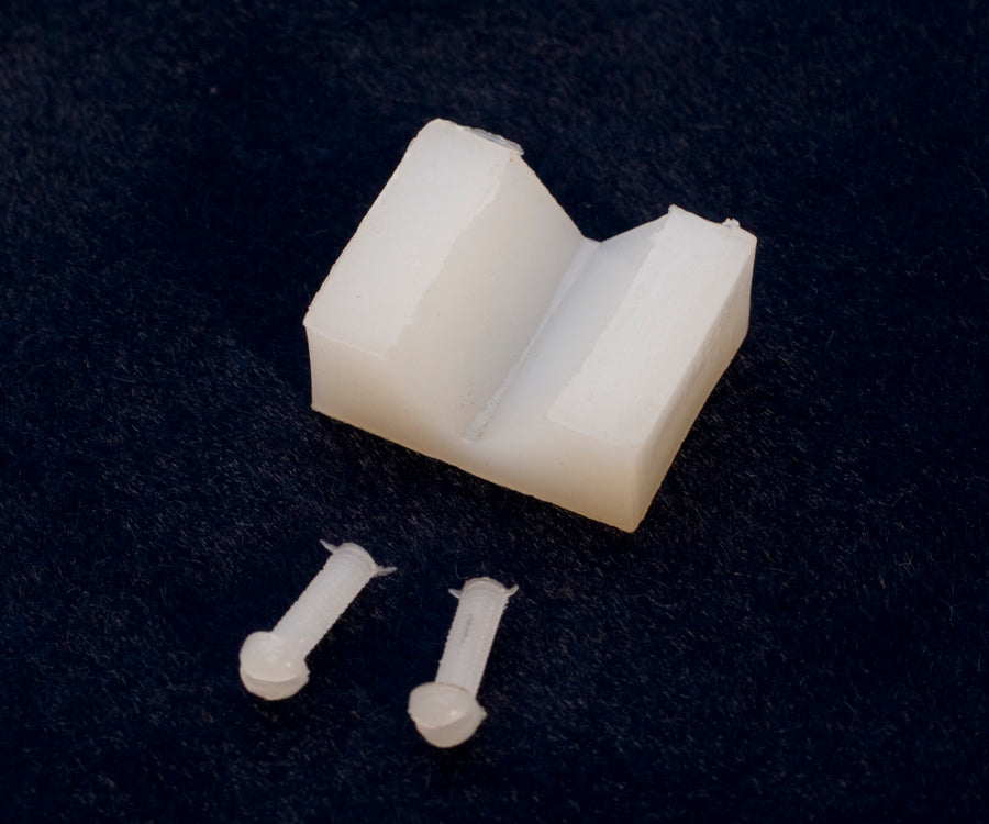 Pair of replacement jaws for PLR-835.00 with two screws on black background