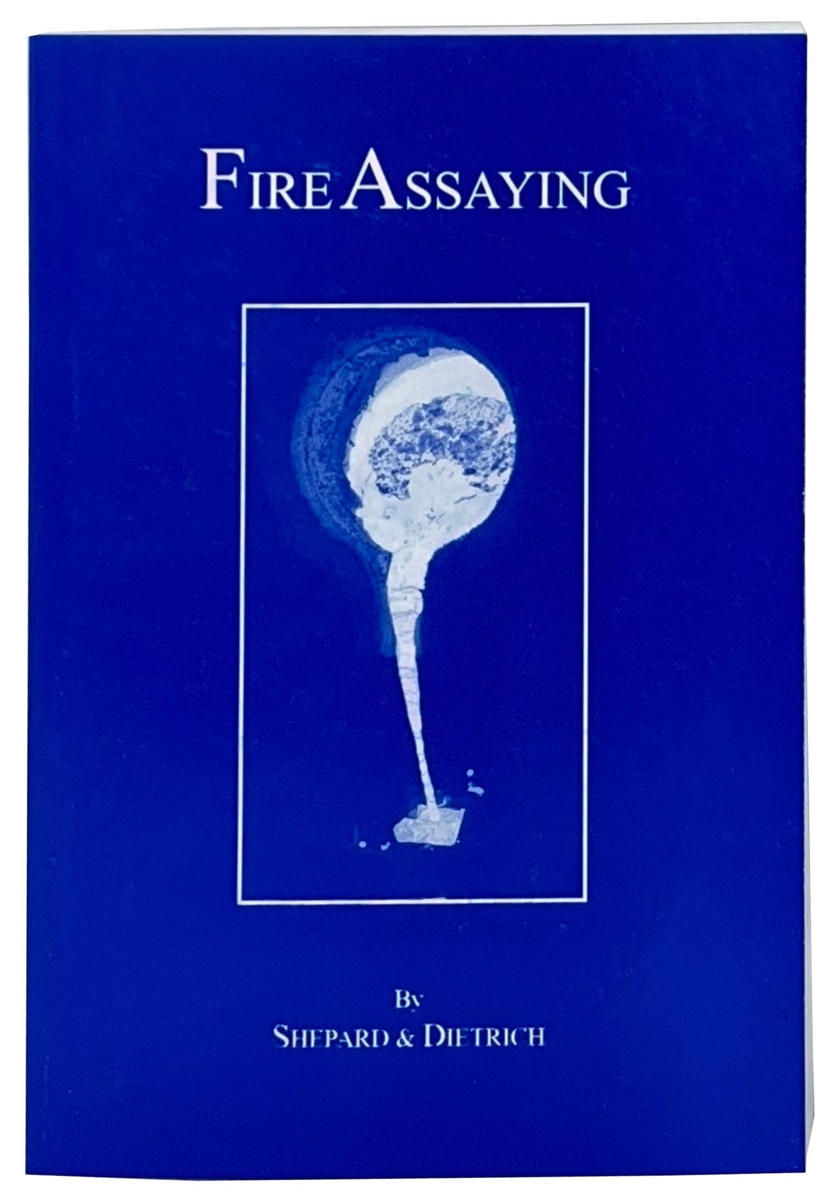 Fire Assaying book by Shepard & Dietrich with step-by-step metallurgical analysis guide on blue cover