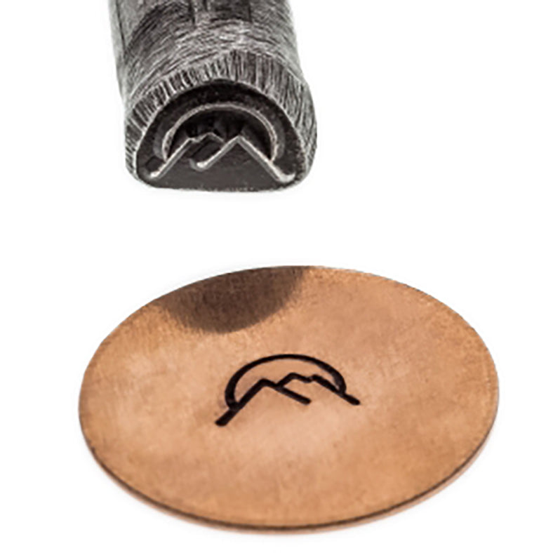 Southwest S-24 Moon Over Mountains steel stamp with moon and mountain design on metal surface