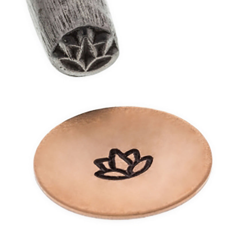 Close-up of Rosebud/Lotus Flower Stamp and its impression on a copper metal surface