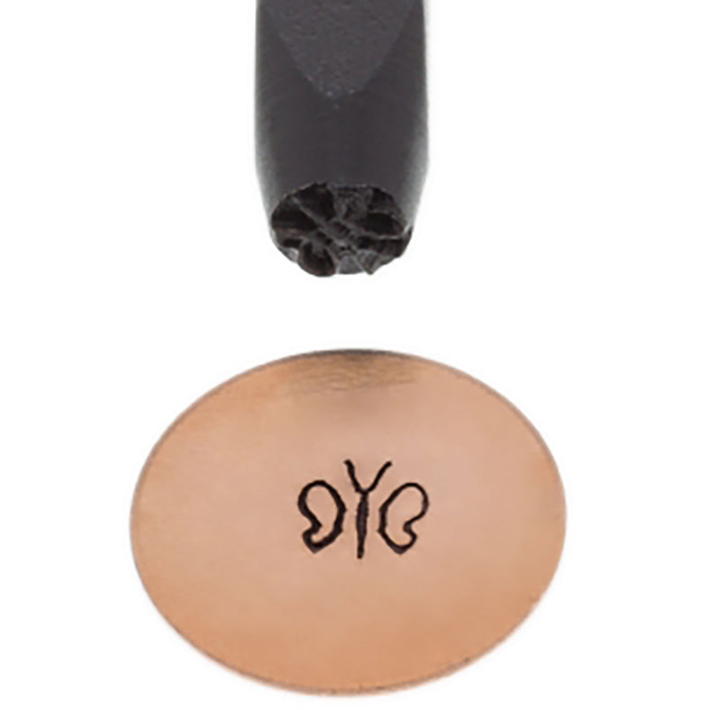 Close-up of 5 mm Butterfly Elite Design Stamp with black-coated carbon steel tip and engraved butterfly imprint on metal surface
