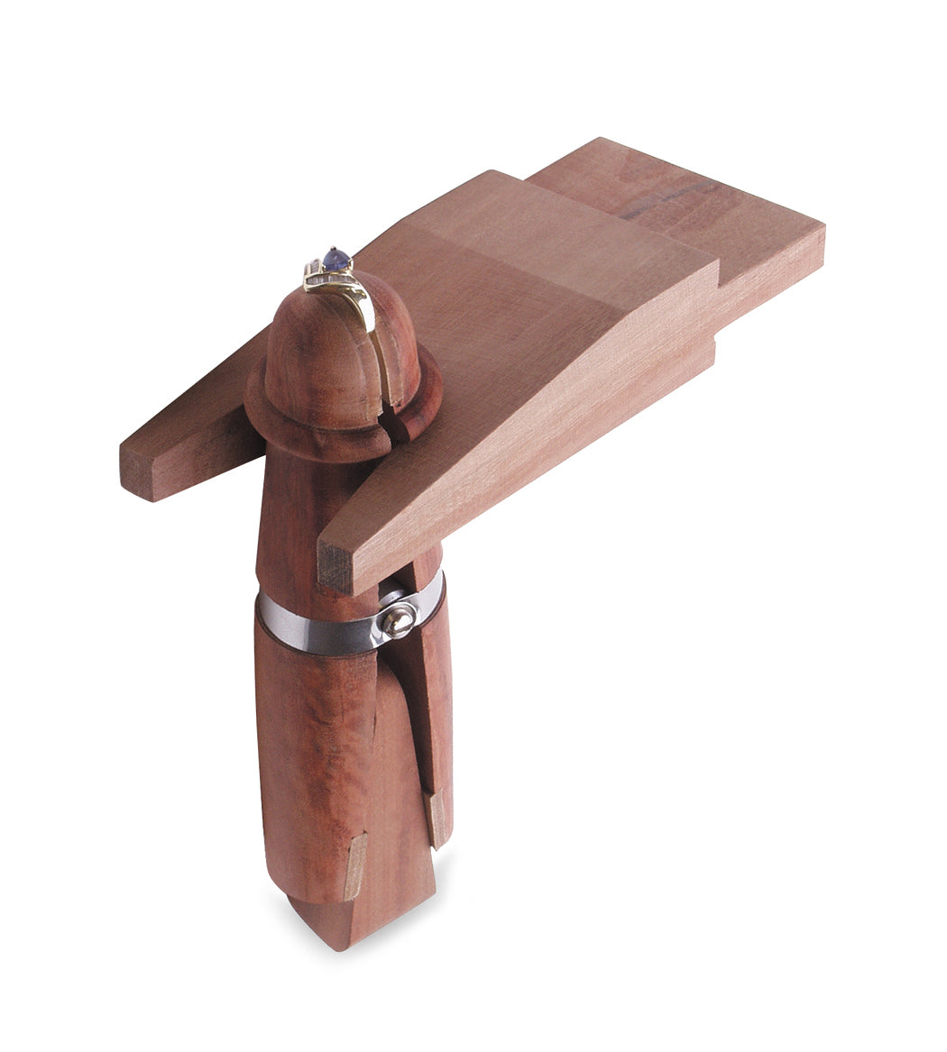 Mahogany ring clamp with bench pin and leather-jawed grip for jewelry making.