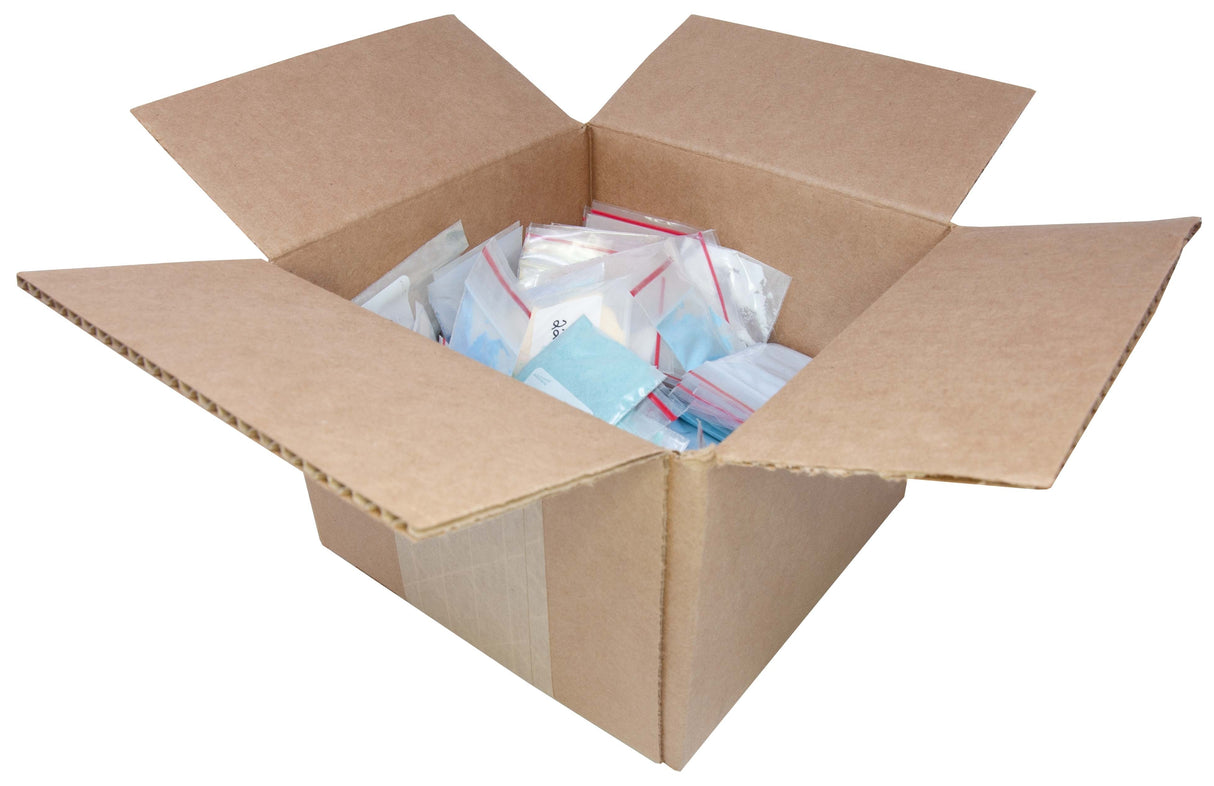 Open cardboard box filled with small sealed bags of Thompson Enamels Complete Color Sampler for metal artistry