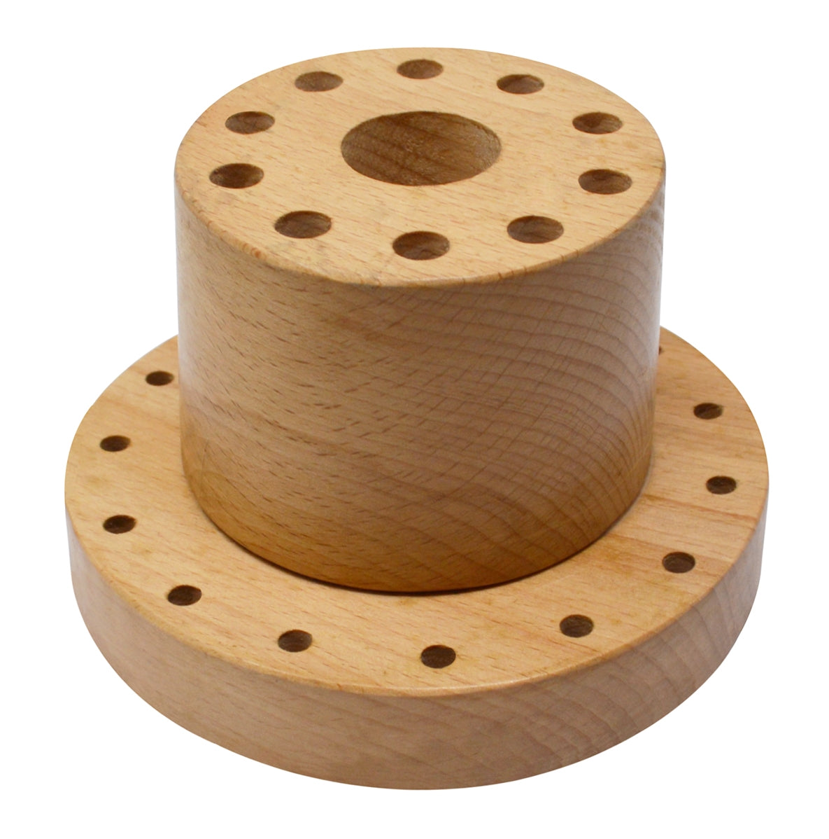 Hardwood benchtop tool organizer with multiple hole sizes for files, polishing wheels, and burs on a workshop bench