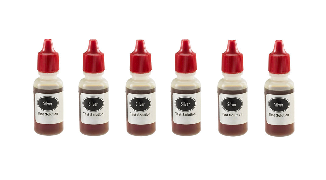 Pack of six silver testing acid bottles with red caps for precise lab testing