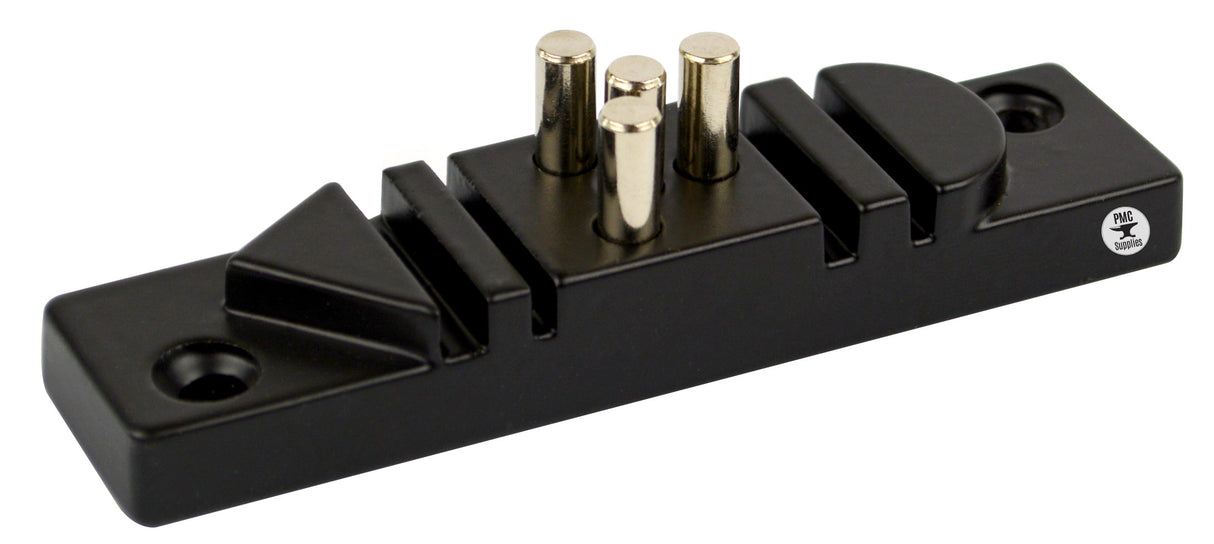 Black wire bending jig with four removable steel pins and multiple shaped slots for precise wire shaping.