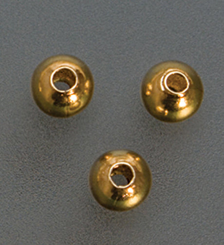 Close-up of gold plated seamed bead crimp covers 3mm for jewelry making