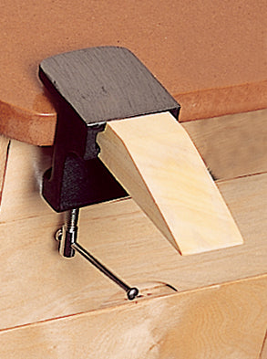 Bench pin and anvil clamped to wooden workbench for metal and wood crafting tasks