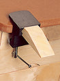 Bench pin and anvil clamped to wooden workbench for metal and wood crafting tasks