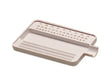 Small white sorting tray with grooves and pour spout for organizing diamonds, pearls, and small gemstones on workbench