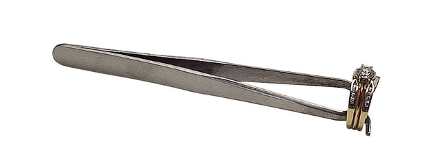 4-1/2 inch ring-setting soldering tweezers holding a gold ring with diamond, precision tool for jewelers